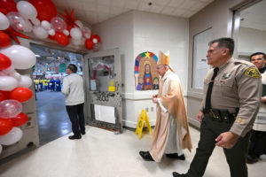 Archbishop José H. Gomez and Los Angeles County Sheriff Robert Luna walk into Century Regional Detention Facility in Lynwood, LA County’s largest women’s jail, during Christmas Mass Dec. 25, 2025.  (John McCoy)