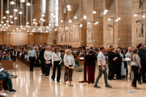 Catechists and catechumens process to the altar with the Book of the Elect during the Rite of Election ceremony at the Cathedral of Our Lady of the Angels on Feb. 15. (Peter Lobato)