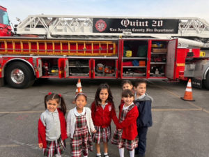 Students at St. Linus School in Norwalk pose with a Los Angeles County Fire Department truck during Catholic Schools Week. (St. Linus School)