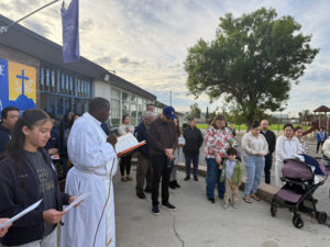 Father Charles Mpiima, a visiting priest from Uganda, offers blessings at St. Paul of the Cross School in La Mirada during Catholic Schools Week. (St. Paul of the Cross School)