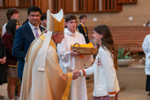 Archbishop José H. Gomez congratulates students who were recipients at the 2026 Christian Service Awards Mass on March 10 at the Cathedral of Our Lady of the Angels. (John Rueda)