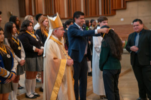 Archbishop José H. Gomez looks on as Paul Escala, superintendent of LA Catholic schools, awards students who were recipients at the 2026 Christian Service Awards Mass on March 10 at the Cathedral of Our Lady of the Angels. (John Rueda)