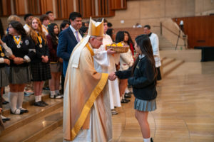 Archbishop José H. Gomez congratulates students who were recipients at the 2026 Christian Service Awards Mass on March 10 at the Cathedral of Our Lady of the Angels. (John Rueda)