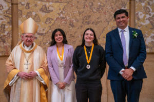 Archbishop José H. Gomez and Paul Escala, superintendent of LA Catholic schools, pose with students who were recipients at the 2026 Christian Service Awards Mass on March 10 at the Cathedral of Our Lady of the Angels. (John Rueda)