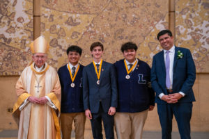 Archbishop José H. Gomez and Paul Escala, superintendent of LA Catholic schools, pose with students who were recipients at the 2026 Christian Service Awards Mass on March 10 at the Cathedral of Our Lady of the Angels. (John Rueda)