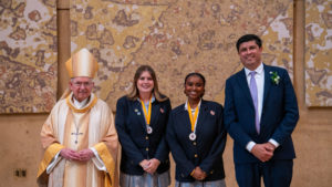 Archbishop José H. Gomez and Paul Escala, superintendent of LA Catholic schools, pose with students who were recipients at the 2026 Christian Service Awards Mass on March 10 at the Cathedral of Our Lady of the Angels. (John Rueda)