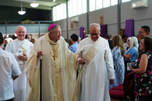 Bishop Edward Clark greets well-wishers following a Mass at St. Maria Goretti Church in Long Beach March 28 celebrating his 25th anniversary of episcopal ordination. (Peter Lobato)