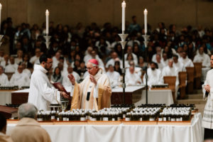 Archbishop José H. Gomez blesses the holy oils at the Cathedral of Our Lady of the Angels during the Chrism Mass on March 30. (Peter Lobato)