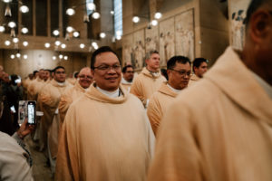 Priests in the Archdiocese of Los Angeles process into the Cathedral of Our Lady of the Angels during the Chrism Mass on March 30. (Peter Lobato)