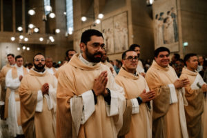 Priests in the Archdiocese of Los Angeles process into the Cathedral of Our Lady of the Angels during the Chrism Mass on March 30. (Peter Lobato)
