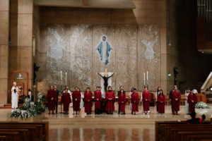 Those preparing to be baptized into the Catholic Church stand on the altar during the Easter Vigil at the Cathedral of Our Lady of the Angels on April 4. (Peter Lobato)