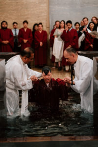 Richard Ker gets baptized during the Easter Vigil on April 4 at the Cathedral of Our Lady of the Angels. (Peter Lobato)