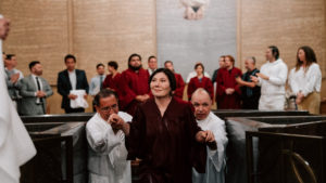 Cynthia Miller reacts to getting baptized during the Easter Vigil on April 4 at the Cathedral of Our Lady of the Angels. (Peter Lobato)