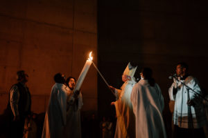 Archbishop José H. Gomez lights the Paschal candle during the Easter Vigil at the Cathedral of Our Lady of the Angels on April 4. (Peter Lobato)