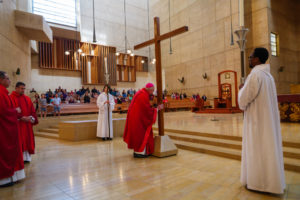 Archbishop José H. Gomez kisses the cross during the Good Friday liturgy at the Cathedral of Our Lady of the Angels on April 3. (Reese Cuevas)