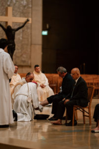 Archbishop José H. Gomez washes the feet of parishioners during the Mass of the Lord's Supper at the Cathedral of Our Lady of the Angels on April 2. (Peter Lobato)
