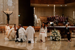 Archbishop José H. Gomez washes the feet of parishioners during the Mass of the Lord's Supper at the Cathedral of Our Lady of the Angels on April 2. (Peter Lobato)
