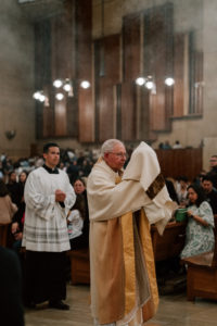Archbishop José H. Gomez carries the holy Eucharist during the Mass of the Lord's Supper at the Cathedral of Our Lady of the Angels on April 2. (Peter Lobato)