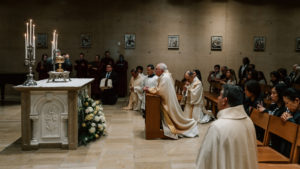 Archbishop José H. Gomez prays in front of the holy Eucharist in the chapel below the Cathedral of Our Lady of the Angels during the Mass of the Lord's Supper on April 2. (Peter Lobato)