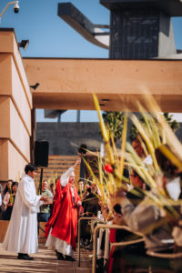 Archbishop José H. Gomez blesses attendees carrying their palms before the Palm Sunday Mass on March 29 at the Cathedral of Our Lady of the Angels. (Isabel Cacho)