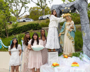 Students at Immaculate Heart School in Los Feliz crown their Virgin Mary statue during a ceremony at the school. (Immaculate Heart School)