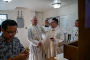 Father Shengda (Martin) Zhu prepares for his first Mass at his home parish of St. Thomas Aquinas Church in Monterey Park on May 31. (John Rueda)