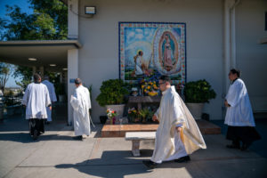 Father Shengda (Martin) Zhu walks to prepare for his first Mass at his home parish of St. Thomas Aquinas Church in Monterey Park on May 31. (John Rueda)