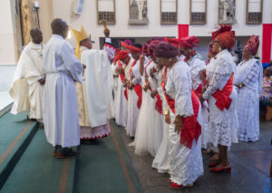 Cardinal Peter Ebere Okpaleke of Ekwulobia, Nigeria, blesses women at the offertory during a special May 31 Mass at St. Eugene Church in South LA. The cardinal visited LA as part of a tour visiting Nigerian Catholics living in the U.S. (Michael Goulding)