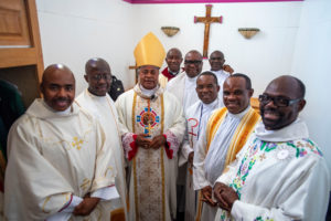 Cardinal Peter Ebere Okpaleke of Ekwulobia, Nigeria, poses with priests and deacons before a special May 31 Mass at St. Eugene Church in South LA. The cardinal visited LA as part of a tour visiting Nigerian Catholics living in the U.S. (Michael Goulding)
