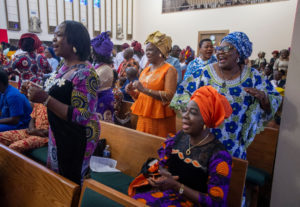 Parishioners at St. Eugene Church in South LA sing during a special May 31 Mass with Cardinal Peter Ebere Okpaleke of Ekwulobia, Nigeria, who visited LA as part of a tour visiting Nigerian Catholics living in the U.S. (Michael Goulding)