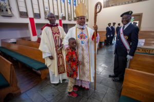 Cardinal Peter Ebere Okpaleke of Ekwulobia, Nigeria, poses with a young boy following a special May 31 Mass at St. Eugene Church in South LA. The cardinal visited LA as part of a tour visiting Nigerian Catholics living in the U.S. (Michael Goulding)