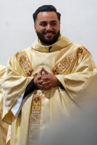 Father David Zamora smiles during his first Mass at his home parish of Sacred Heart Church in Lancaster on May 31. (Katie Trejo)
