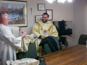 Father David Zamora smiles while getting ready for his first Mass at his home parish of Sacred Heart Church in Lancaster on May 31. (Katie Trejo)