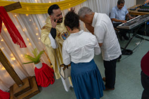 Father David Zamora offers blessings following his first Mass at his home parish of Sacred Heart Church in Lancaster on May 31. (Katie Trejo)