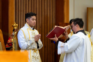 Father Jerick Alenton prays during his first Mass at his home parish of St. Clare of Assisi Church in Santa Clarita on May 31. (Joe Garcia III)