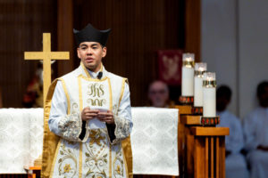 Father Jerick Alenton addresses the crowd at the end of his first Mass at his home parish of St. Clare of Assisi Church in Santa Clarita on May 31. (Joe Garcia III)