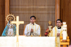 Father Jerick Alenton prays during his first Mass at his home parish of St. Clare of Assisi Church in Santa Clarita on May 31. (Joe Garcia III)