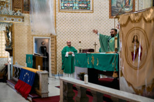 Venezuelan priest Father Alexander Hernandez, CSsR, celebrates a Mass for victims of the Venezuela earthquakes Sunday, June 28, at Nuestra Señora de Guadalupe Church in East LA. (John Geronilla)