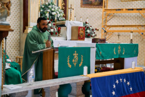 Venezuelan priest Father Alexander Hernandez, CSsR, celebrates a Mass for victims of the Venezuela earthquakes Sunday, June 28, at Nuestra Señora de Guadalupe Church in East LA. (John Geronilla)