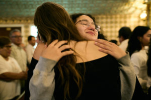 Parishioners embrace during a special Mass at Nuestra Señora de Guadalupe Church in East LA on Sunday, June 28, to pray for victims of the Venezuela earthquakes. (John Geronilla)
