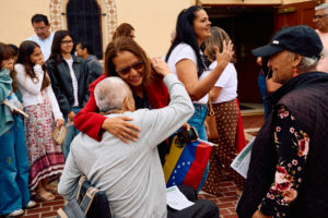 Parishioners embrace following a special Mass at Nuestra Señora de Guadalupe Church in East LA on Sunday, June 28, to pray for victims of the Venezuela earthquakes. (John Geronilla)