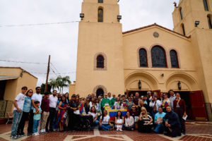 Attendees pose following a Mass for victims of the Venezuela earthquakes Sunday, June 28, at Nuestra Señora de Guadalupe Church in East LA. (John Geronilla)