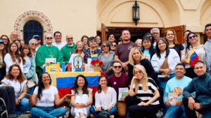 Attendees pose following a Mass for victims of the Venezuela earthquakes Sunday, June 28, at Nuestra Señora de Guadalupe Church in East LA. (John Geronilla)