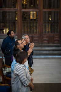 Pilgrims clasp their hands in prayer during Mass at the Mexico City Metropolitan Cathedral on July 10. (Isabel Cacho)