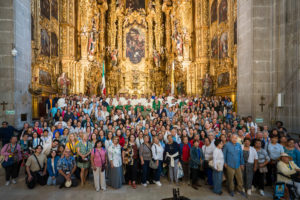 Archbishop José  H. Gomez poses at the Mexico City Metropolitan Cathedral on July 10 with a large group of pilgrims, priests, and deacons who traveled for the Mexico City pilgrimage. (Isabel Cacho)
