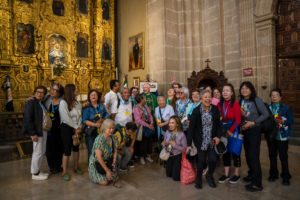 Pilgrims pose with LA Auxiliary Bishop Matthew Elshoff at a Mass at the Mexico City Metropolitan Cathedral on July 10. (Isabel Cacho)