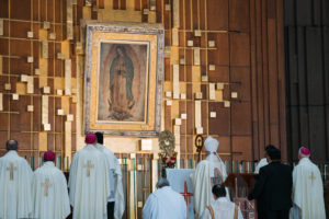 Archbishop José  H. Gomez and concelebrants face the original tilma featuring Our Lady of Guadalupe during a special Mass at the Basilica of Our Lady of Guadalupe in Mexico City on July 11. (Isabel Cacho)