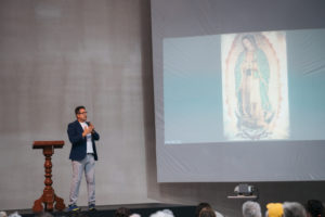 Ernesto Vega, coordinator of the faith formation ministry for Hispanic adults of the Archdiocese of Los Angeles, speaks to pilgrims about Our Lady of Guadalupe following Mass at the Basilica of Our Lady of Guadalupe in Mexico City on July 11. (Isabel Cacho)