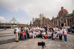Pilgrims take a photo outside the Basilica of Our Lady of Guadalupe in Mexico City on July 11. (Isabel Cacho)