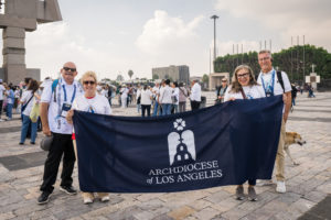 Pilgrims carry an Archdiocese of Los Angeles banner outside the Basilica of Our Lady of Guadalupe in Mexico City on July 11. (Isabel Cacho)